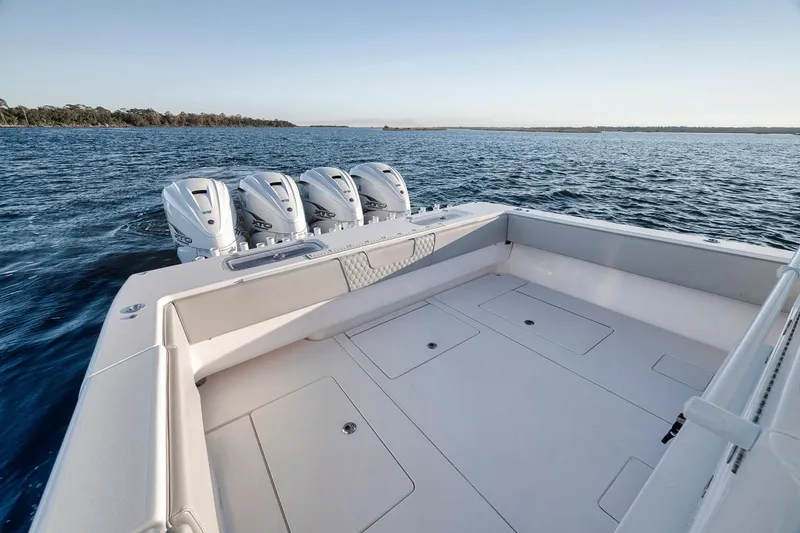 Slide: The Image of 2021 Contender 44 ST boat with quad engines on open water. - 28