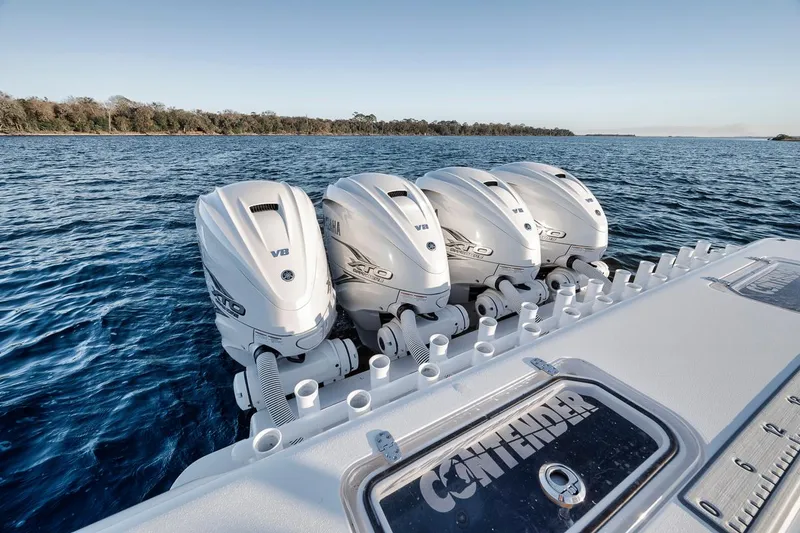 Slide: The Image of 2021 Contender 44 ST boat with four powerful outboard engines on open water. - 29
