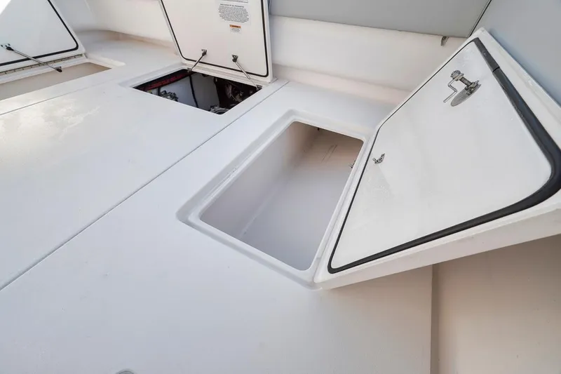Slide: The Image of Open storage compartment on 2021 Contender 44 ST boat deck. - 33