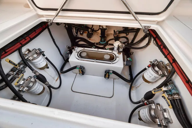 Slide: The Image of 2021 Contender 44 ST engine compartment with fuel filters and hoses. - 34