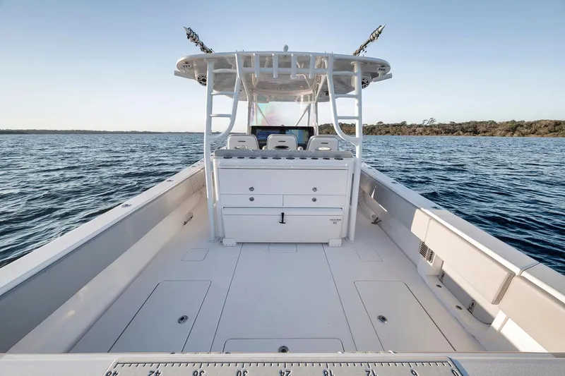 Slide: The Image of 2021 Contender 44 ST boat on open water, showcasing spacious deck and seating. - 35