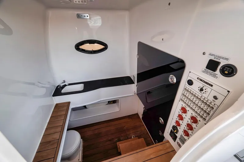 Slide: The Image of 2021 Contender 44 ST cabin interior with control panel and wooden flooring. - 43