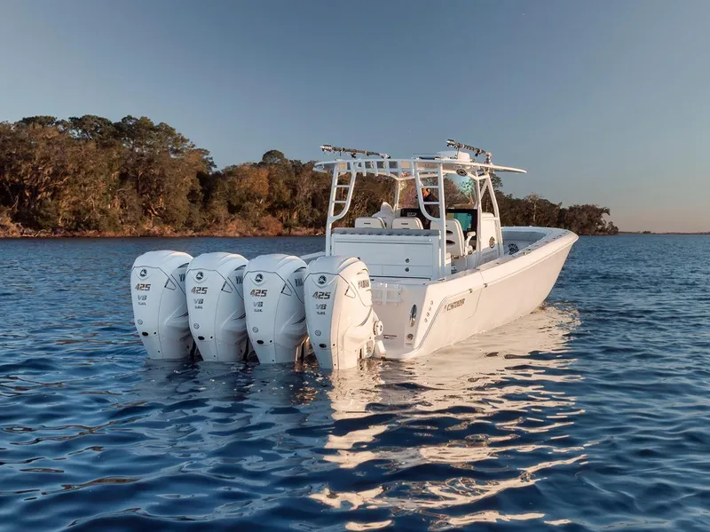 Slide: The Image of 2021 Contender 44 ST boat with four engines on calm water. - 9