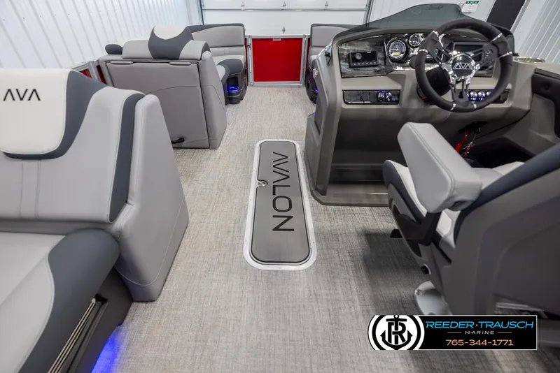Slide: The Image of 2025 Avalon LSZ VRB boat interior with modern seating and steering console. - 17
