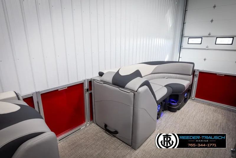 Slide: The Image of 2025 Avalon LSZ VRB pontoon boat interior with modern seating in a showroom. - 20