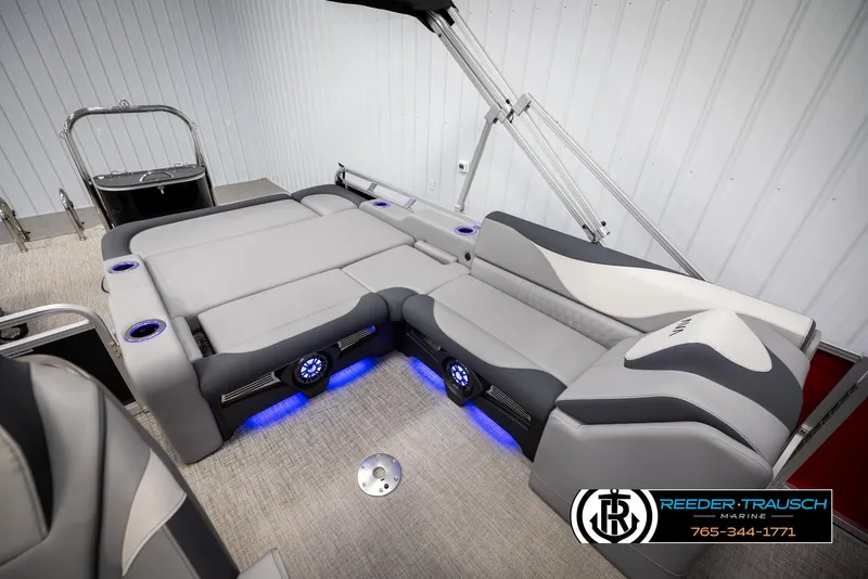 Slide: The Image of Luxurious interior of 2025 Avalon LSZ VRB pontoon boat with modern seating and blue LED lighting. - 22