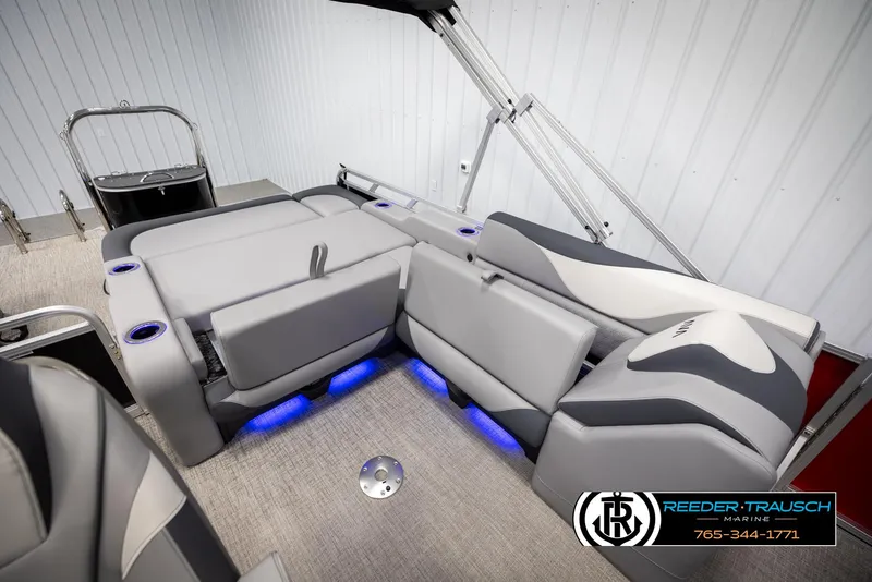 Slide: The Image of 2025 Avalon LSZ VRB boat interior with gray seating and blue LED lighting. - 25