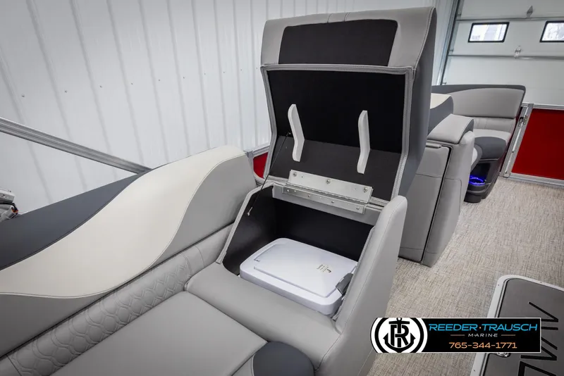 Slide: The Image of 2025 Avalon LSZ VRB boat interior with storage compartment and seating. - 29