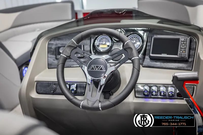 Slide: The Image of Steering wheel and dashboard of 2025 Avalon LSZ VRB boat, featuring modern controls and design. - 30