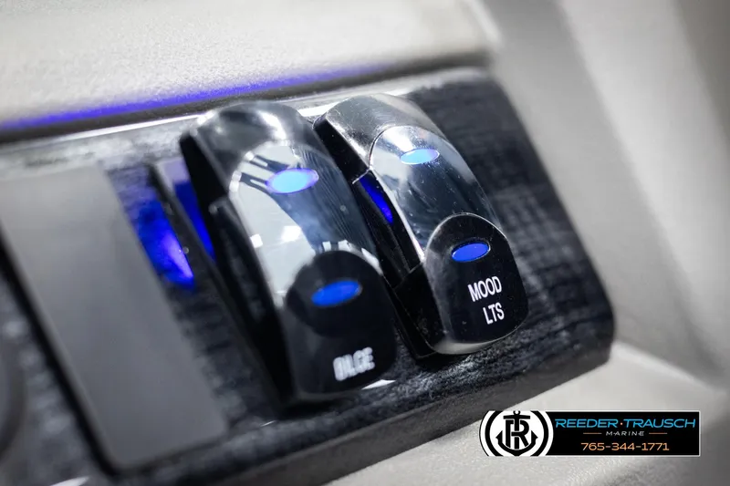 Slide: The Image of 2025 Avalon LSZ VRB dashboard switches with blue LED indicators. - 33