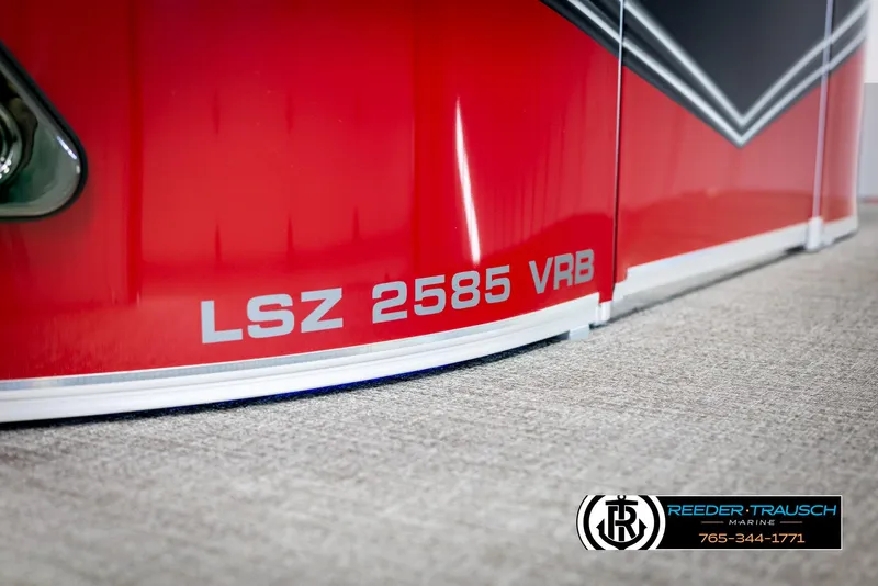 Slide: The Image of 2025 Avalon LSZ VRB boat with red exterior and branding details. - 47
