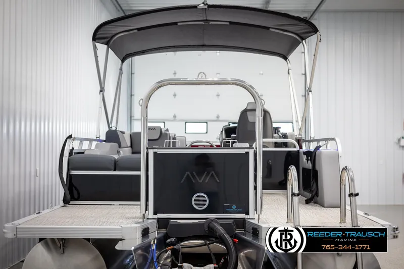 Slide: The Image of 2025 Avalon LSZ VRB pontoon boat in a showroom, featuring sleek design and modern amenities. - 7