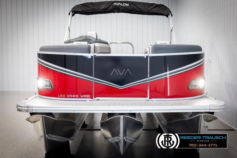Slide: The Image of 2025 Avalon LSZ VRB pontoon boat, red and black design, displayed indoors. - 8