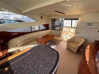 Slide: The Image of Luxurious interior of a 2006 Fairline 50 yacht with elegant seating and modern design. - 10