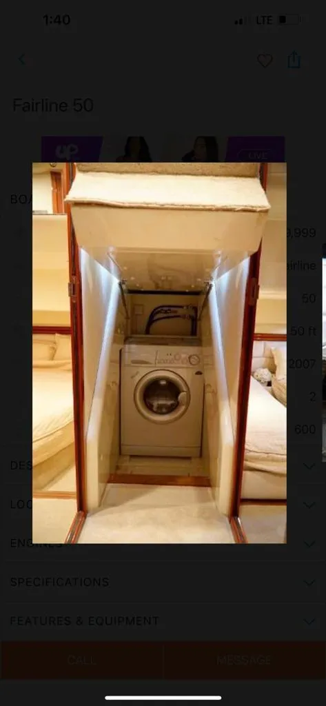 Slide: The Image of Laundry area inside 2006 Fairline 50 yacht, featuring a washing machine. - 13