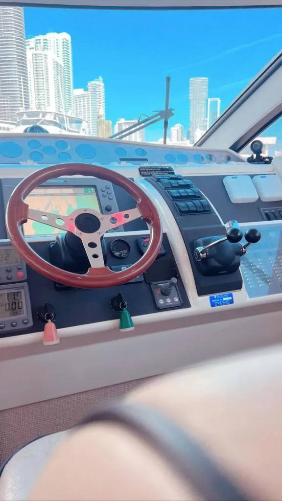 Slide: The Image of Fairline 50 yacht helm, 2006 model, with city skyline in the background. - 5