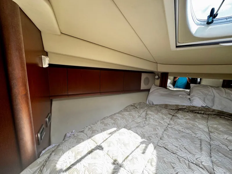 Slide: The Image of Interior cabin of 2007 Sea Ray 40 Sundancer yacht with bed and window. - 28