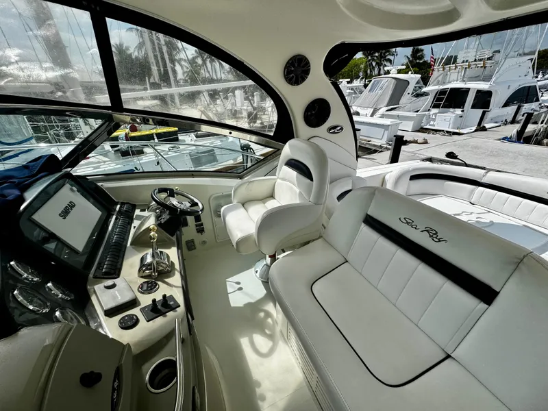 Slide: The Image of Interior of 2007 Sea Ray 40 Sundancer yacht with luxurious seating and control panel. - 36