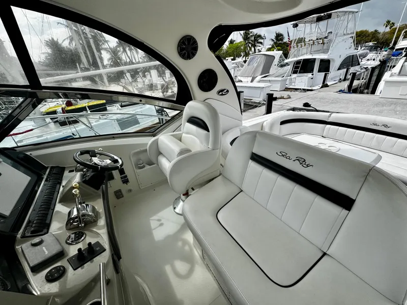 Slide: The Image of Interior of 2007 Sea Ray 40 Sundancer yacht with luxurious seating and helm. - 37