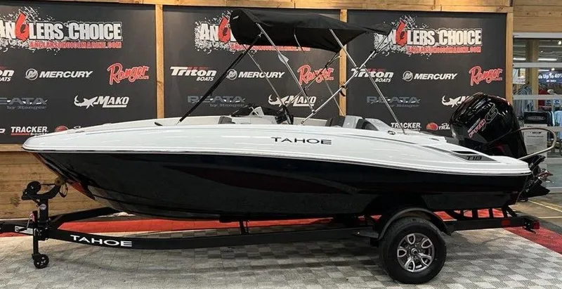 The Image of 2025 Tahoe T18 boat on display with sleek design and black trailer. - 1