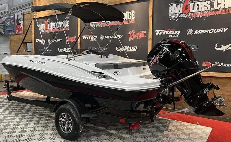 Slide: The Image of 2025 Tahoe T18 boat with outboard motor on display in showroom. - 3