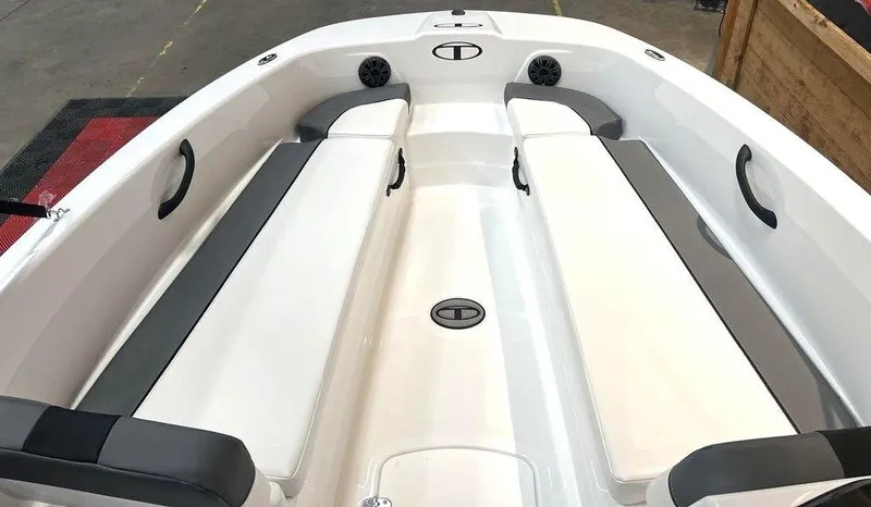 Slide: The Image of 2025 Tahoe T18 boat interior with white and gray seating, featuring storage compartments. - 6