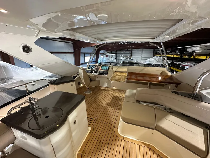 Slide: The Image of Luxurious 2015 Sea Ray L650 Fly yacht interior with sleek design and modern amenities. - 14