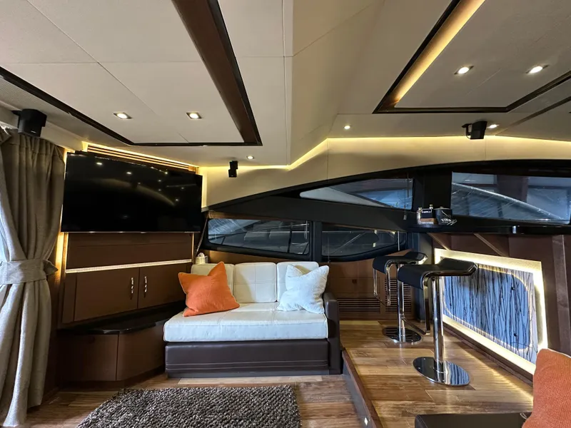 Slide: The Image of Luxurious interior of 2015 Sea Ray L650 Fly yacht with modern seating and ambient lighting. - 28