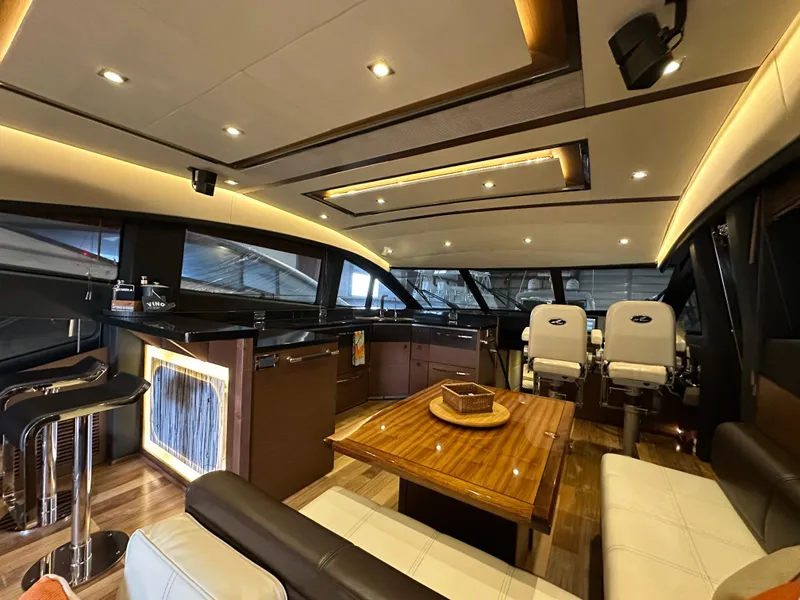 Slide: The Image of Luxurious interior of 2015 Sea Ray L650 Fly yacht with modern seating and elegant lighting. - 29