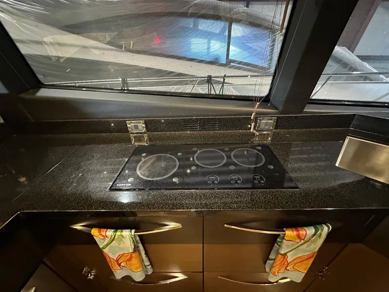 Slide: The Image of Modern kitchen in 2015 Sea Ray L650 Fly yacht with sleek stovetop. - 33