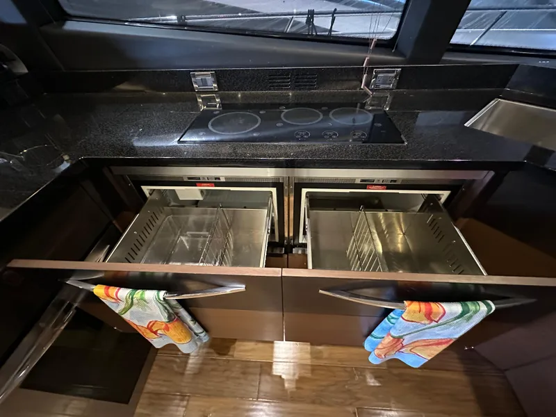 Slide: The Image of Modern kitchen in 2015 Sea Ray L650 Fly yacht with sleek appliances and storage. - 36