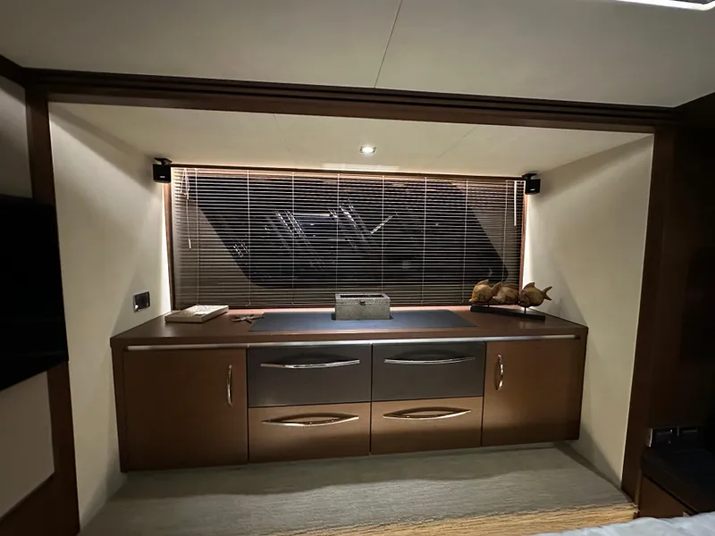 Slide: The Image of Luxurious interior of 2015 Sea Ray L650 Fly yacht with elegant cabinetry and ambient lighting. - 49