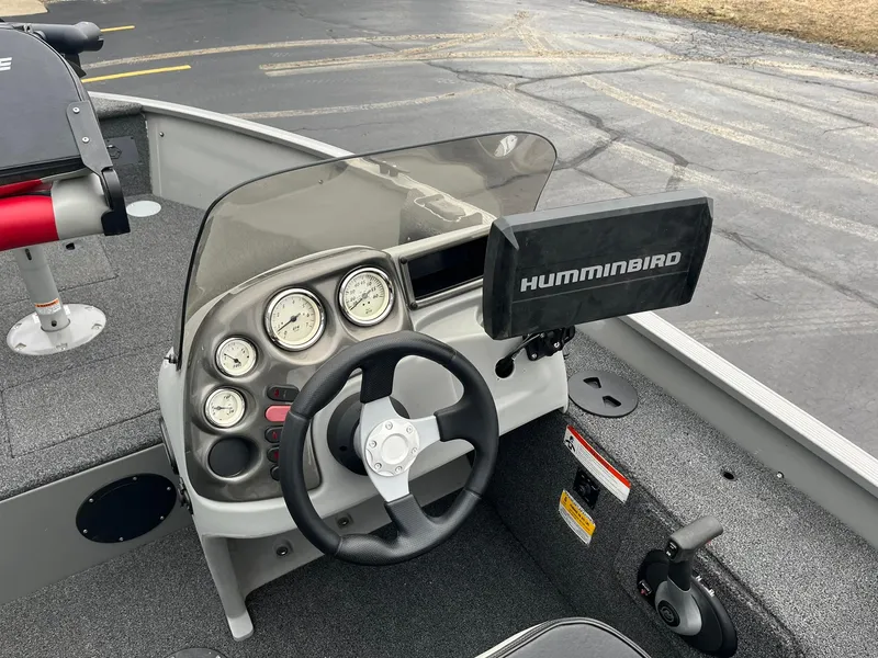 Slide: The Image of Steering console of 2011 Lowe FM 165 boat with Humminbird fish finder. - 11