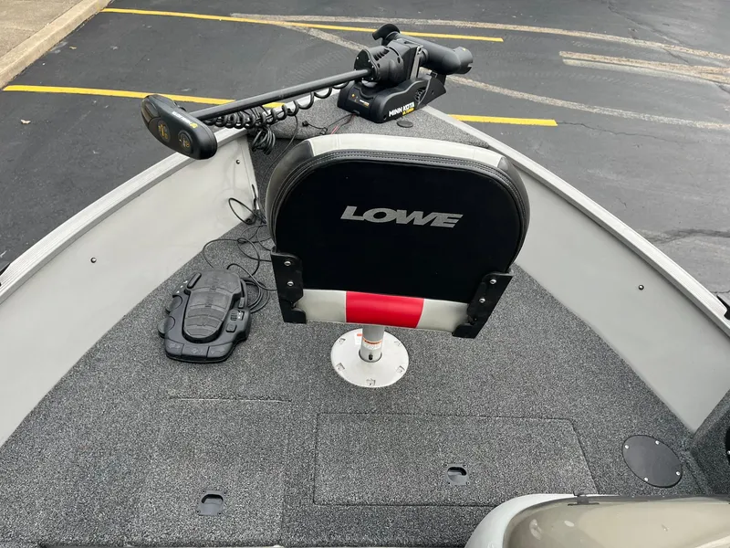 Slide: The Image of 2011 Lowe FM 165 boat interior with seat and trolling motor. - 14