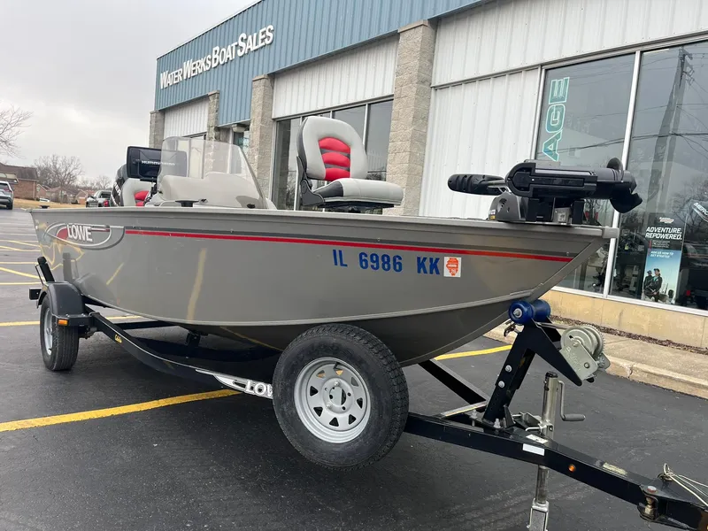 Slide: The Image of 2011 Lowe FM 165 boat on trailer outside Water Werks Boat Sales. - 2