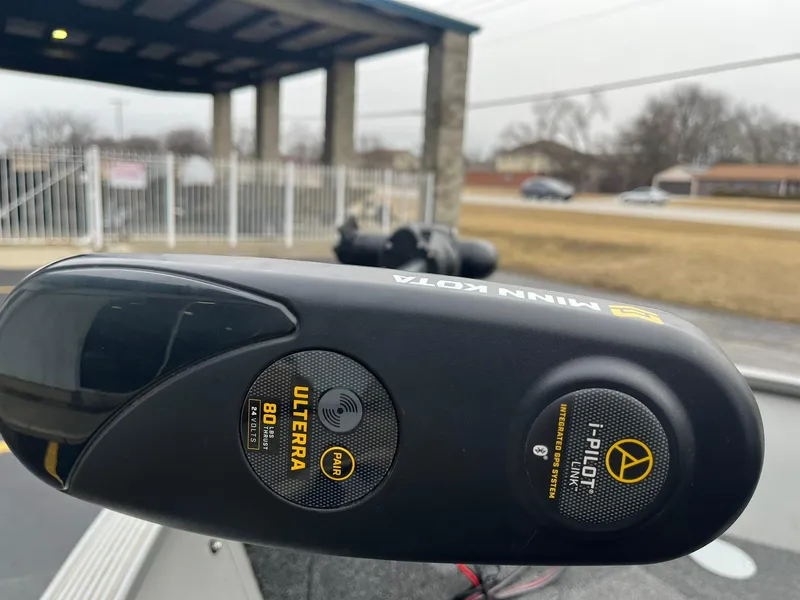 Slide: The Image of Minn Kota Ulterra motor on a 2011 Lowe FM 165 boat, outdoor setting. - 24