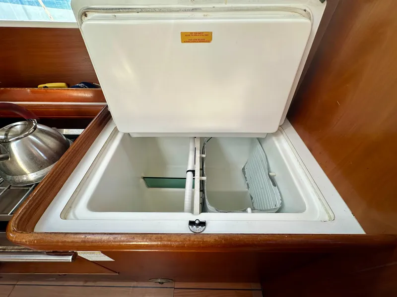 Slide: The Image of Open refrigerator compartment in 2002 Beneteau Oceanis Clipper 393 yacht kitchen. - 22