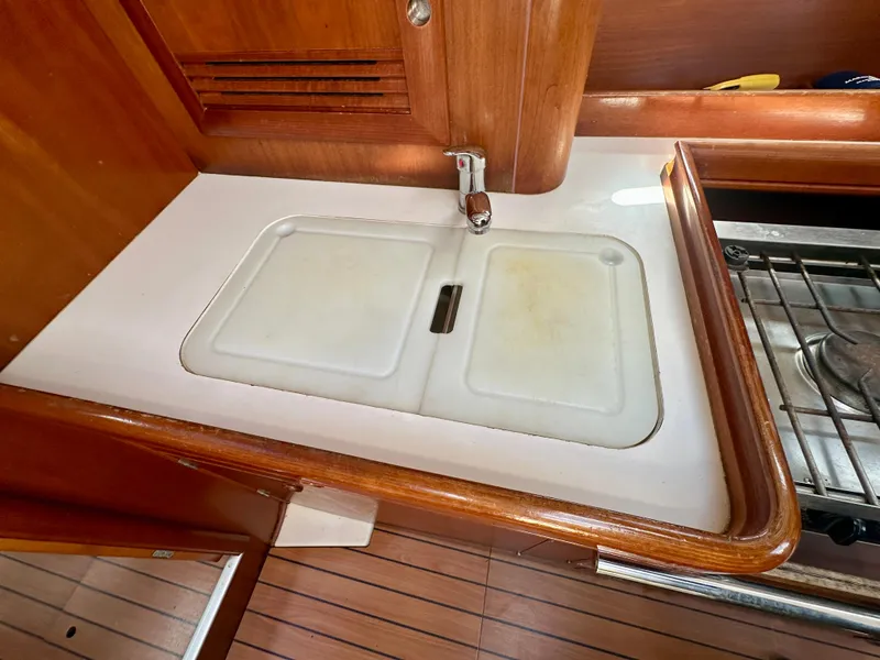 Slide: The Image of Galley sink area in 2002 Beneteau Oceanis Clipper 393 yacht. - 23