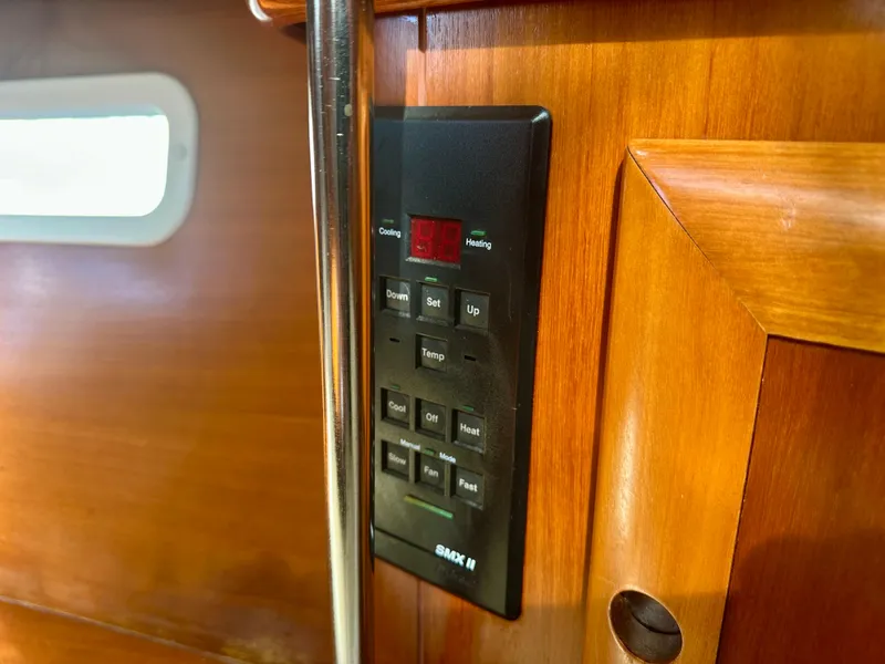 Slide: The Image of Control panel on 2002 Beneteau Oceanis Clipper 393 yacht interior, wooden finish. - 27