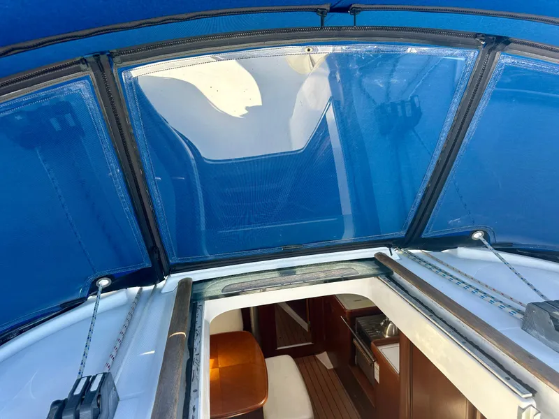 Slide: The Image of Interior view of 2002 Beneteau Oceanis Clipper 393 sailboat with blue canopy. - 46