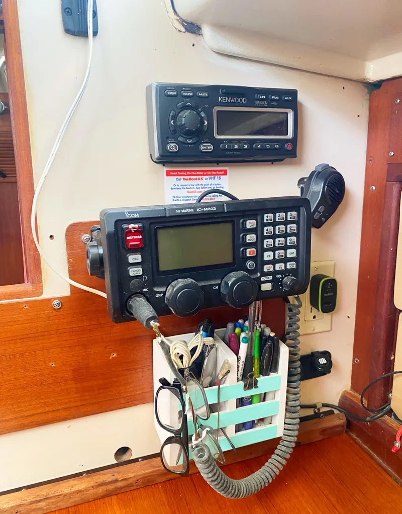 Slide: The Image of 1975 Whitby 42 Center Cockpit radio equipment with navigation tools and accessories. - 37