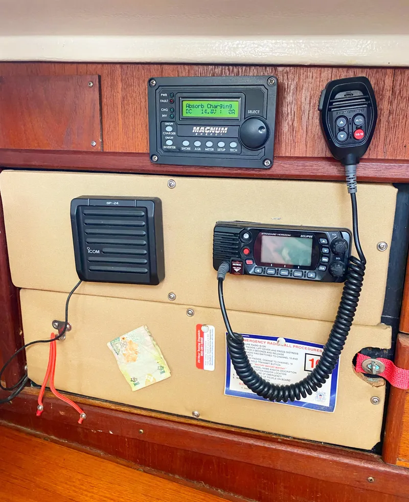 Slide: The Image of 1975 Whitby 42 Center Cockpit radio and control panel with communication equipment. - 38