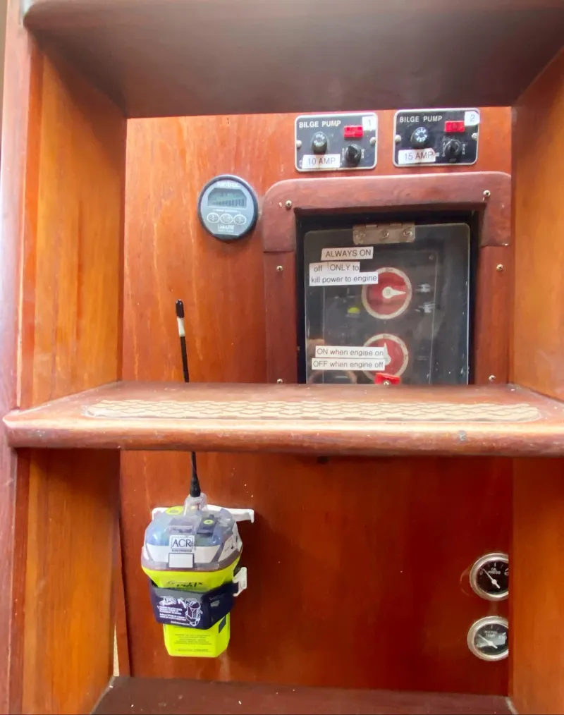 Slide: The Image of Control panel of a 1975 Whitby 42 Center Cockpit sailboat with bilge pump switches. - 39