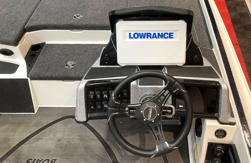 Slide: The Image of 2025 Triton 20XP boat dashboard with Lowrance display and steering wheel. - 5
