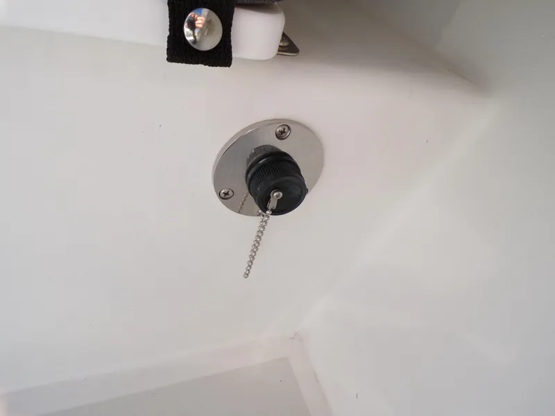 Slide: The Image of 2024 Parker 1801 Center Console boat detail with a metal chain plug. - 11