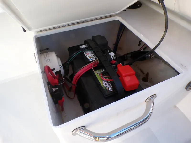 Slide: The Image of Battery compartment of 2024 Parker 1801 Center Console boat, showing wiring and connections. - 14