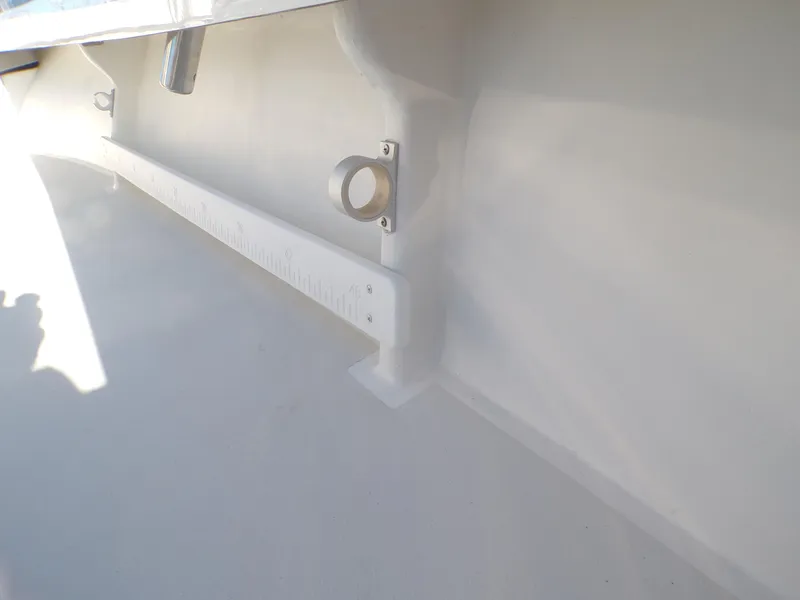 Slide: The Image of 2024 Parker 1801 Center Console boat interior detail with rod holder and ruler. - 17