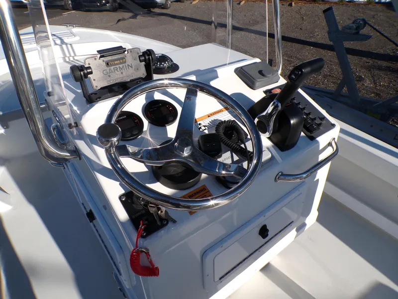 Slide: The Image of 2024 Parker 1801 Center Console boat dashboard with steering wheel and Garmin device. - 20