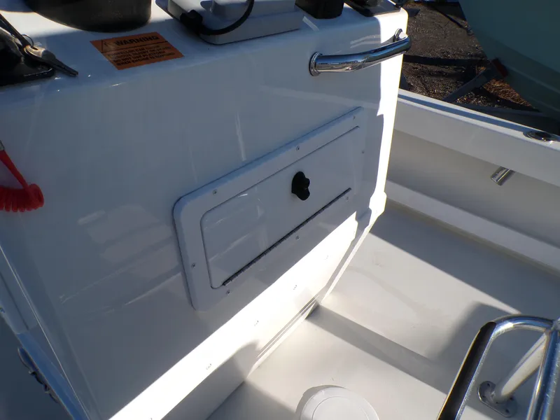 Slide: The Image of 2024 Parker 1801 Center Console boat interior with storage compartment and control panel. - 25