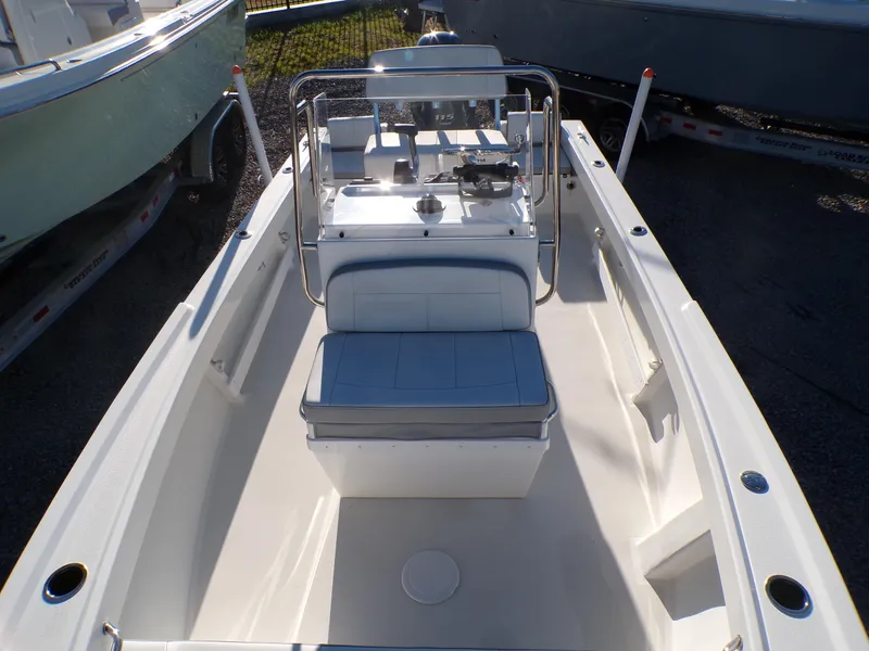 Slide: The Image of 2024 Parker 1801 Center Console boat, interior view, featuring seating and control panel. - 29